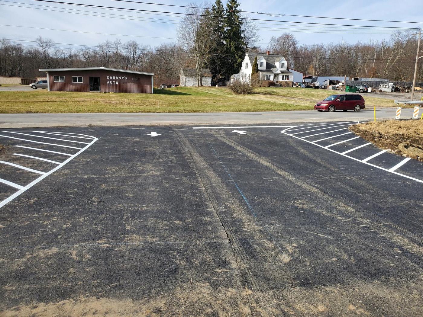 White directional arrows and hatch on a commercial entrance